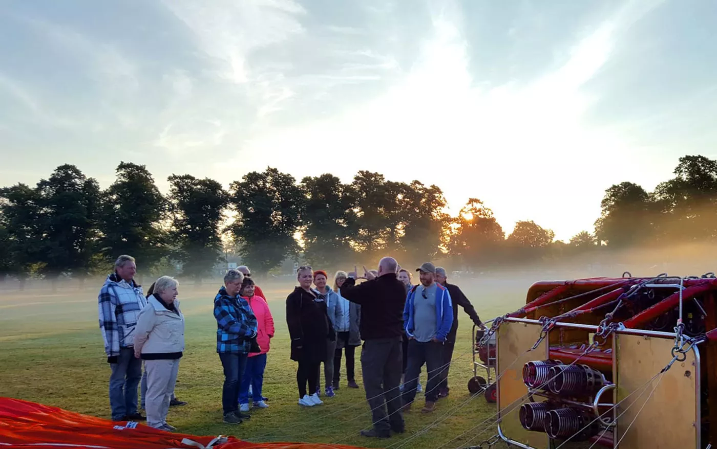 Passengers receiving a hot air balloon flight briefing